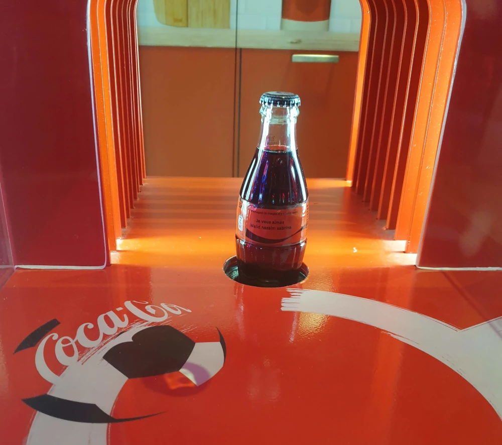 Bouteille en verre personnalisée avec un manchon imprimé sur place